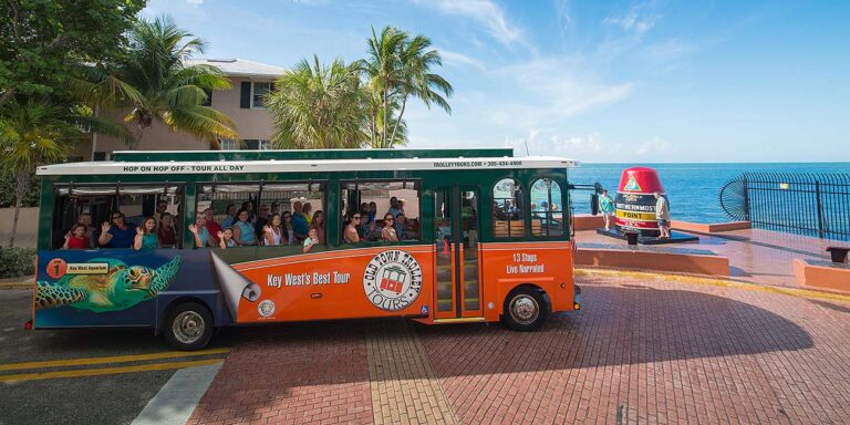 Old Town Trolley in Key West driving past Southernmost Point